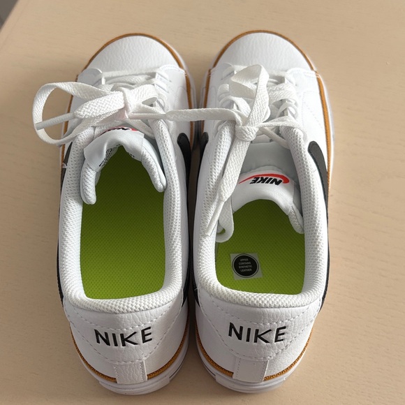 Nike women’s White and Black Sneakers with Gold Accents - Picture 6 of 8